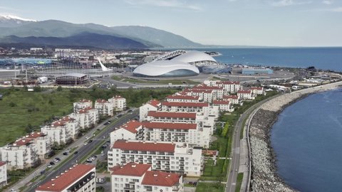 Sochi, Russia - 2021: Olympic flame, flags and Fisht football stadium from above. Aerial view. Sochi, Russia. 
