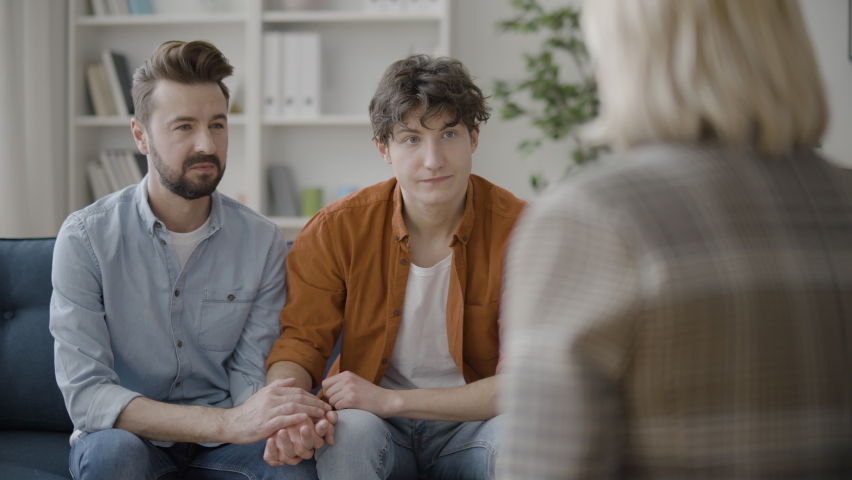 Gay couple talking to psychologist, family undergoing therapy to save marriage Royalty-Free Stock Footage #1072539920