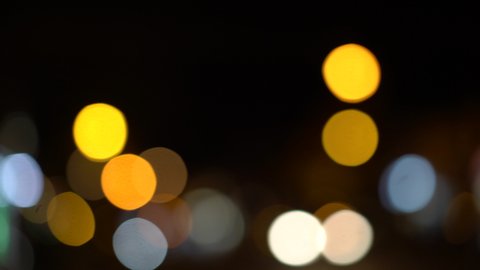 Moving defocused bright lights in the night