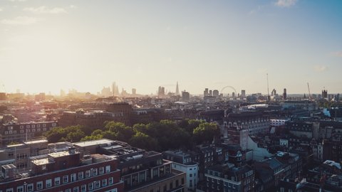 Establishing Aerial View Shot of London UK, early morning, sunrise, city skyline, United Kingdom