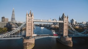 Establishing Aerial View Shot of London UK, sun reflections in Tower Bridge, day, United Kingdom