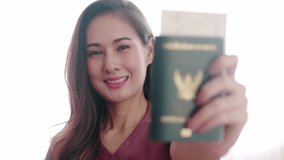 Woman happy portrait with her passport and credit card before travel trip