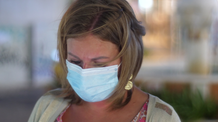 Close Up Caucasian Woman Wearing Face Mask, Blurry City Backdrop