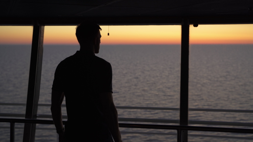 Silhouette of navy captain looking seascape sunset with a binocular, cinematic Royalty-Free Stock Footage #1072550585