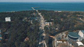 Aerial 4K footage over the main pedestrian Basanavicius street in Palanga resort heading to Baltic sea and pedestrian bridge 