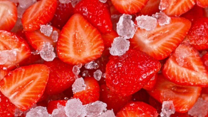 Super Slow Motion Shot of Fresh Strawberries and Crushed Ice Flying Towards Camera at 1000fps. | Shutterstock HD Video #1072566557