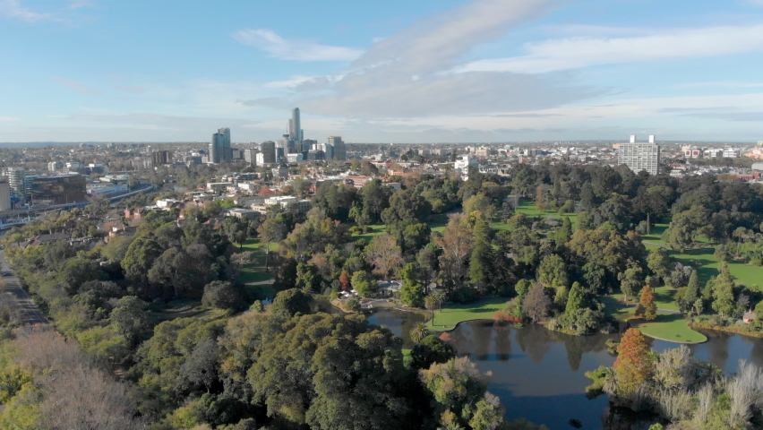 The Royal Botanic Gardens, on the banks of the Yarra River, Melbourne. Behind the gardens are skyscrapers and the suburb of South Yarra. Royalty-Free Stock Footage #1072576037