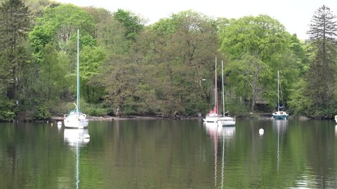 Windermere The Lake District England uk with sailing boats in good spring weather pan