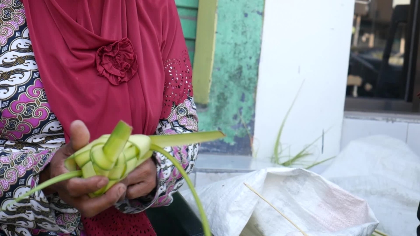Process of making ketupat, special dish served at Ied Fitr celebration in Indonesia