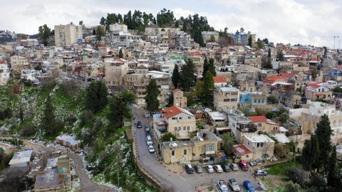 Safed old Jewish quarter houses, with light snow covering rooftops, Aerial view.