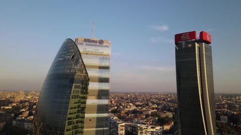 Impressive Aerial view of Milan city skyline, Italy, footage showing new Milano citylife taken in stunning Sunset on 2021