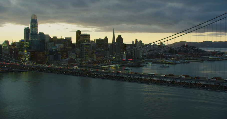 Aerial view of the San Francisco Oakland Bay Bridge full of traffic. Financial district skyline in the background. San Francisco, California. US. Shot in 8K.