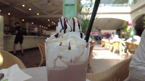 chocolate frappe or frapuccino chocolate milkshake in a coffee shop
