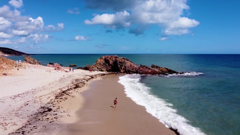 Pedra Furada Beach, Jericoacoara, Brazil. Exotic tropical destination. Holed rock beach. Jericoacoara, Ceara. Tropical travel. Vacation travel. Jericoacoara, Ceara, Brazil. Desert Jericoacoara beach.