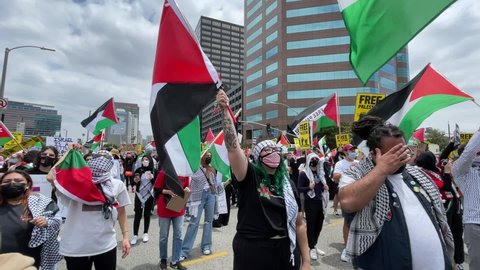 Thousands of demonstrators protest outside the Federal Building against Israel and in support of Palestinians, Saturday, May 15, 2021 in the Westwood section of Los Angeles. 