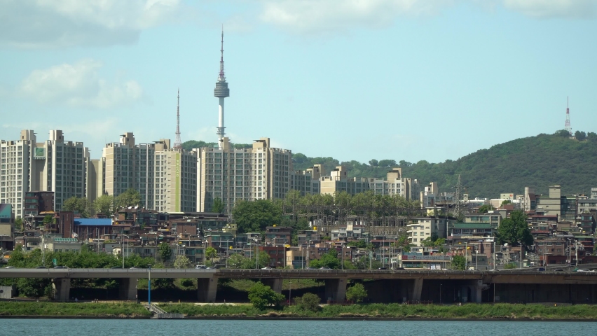 Namsan Tower over Yongsan district viewed from the bank of Han river iconic landmark of Seoul South Korea, also know as N Seoul Tower, YTN Seoul Tower or Seoul Tower Royalty-Free Stock Footage #1072644014