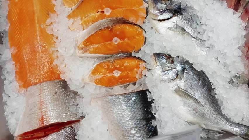 Red fish trout are sold on display in a store. Delicious and healthy sea food, frozen Royalty-Free Stock Footage #1072649633