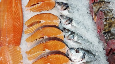 Red fish trout are sold on display in a store. Delicious and healthy sea food, frozen