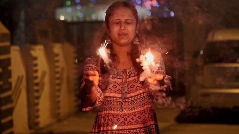 A girl celebrating Diwali festival in india.
