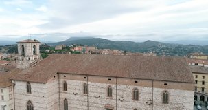 Aerial drone view of Perugia, in Umbria. Morning shot of the church and the square, breathtaking view. With the detail of the fountain and bells. Eurochocolate and Umbria Jazz.