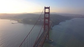 Beautiful aerial Sunset over Downtown San Francisco and the Golden Gate Bridge. Very unique and rare drone aerial footage of California's iconic bridge over the bay.