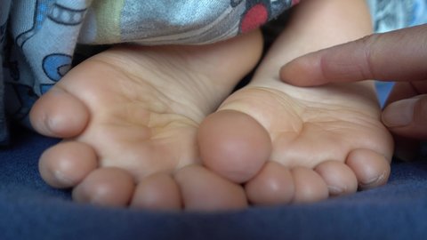 4K Tickling soles of sleeping child
