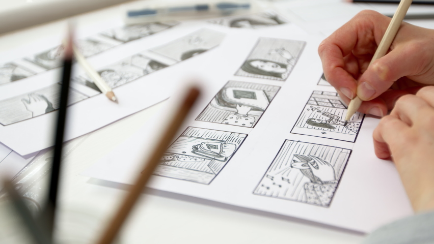 A designer draws a storyboard for an animated film comic strip. Scene sketches for the cartoon. 4K.