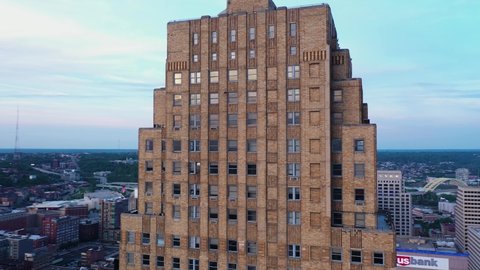 Cincinnati, Ohio, USA - May 18 2021: 4K Drone aerial footage of downtown Cincinnati, Ohio. Drone circles the Carew Tower during magic golden hour.