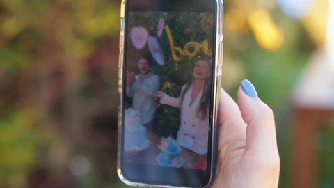 Family documentary recording using phone gender party to reveal baby sex to expectant parents and friends. Gender party. Gender stereotype. 9.5.2021 CZ, Jesenice, Praha 