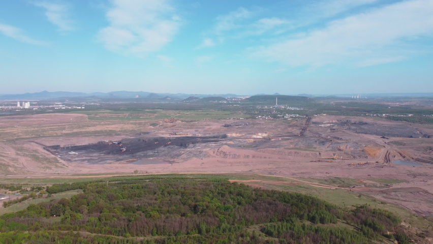 Aerial drone shot of mining landscape and castle Jezeri in foreground