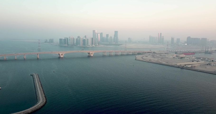 Abu Dhabi in Mist. Aerial View of UAE Capital City and Sheikh Khalifa Bridge on Persian Gulf on Hazy Day, Drone Shot Royalty-Free Stock Footage #1072704791
