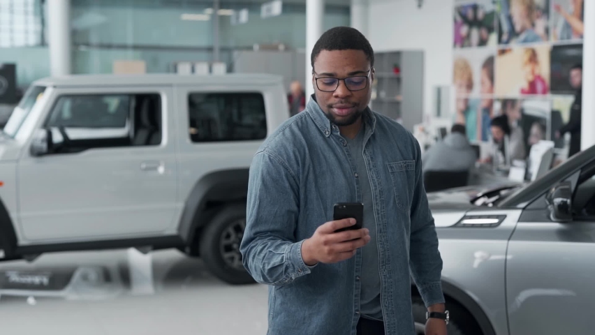 a dark-skinned man quickly receives offers regarding money and purchases