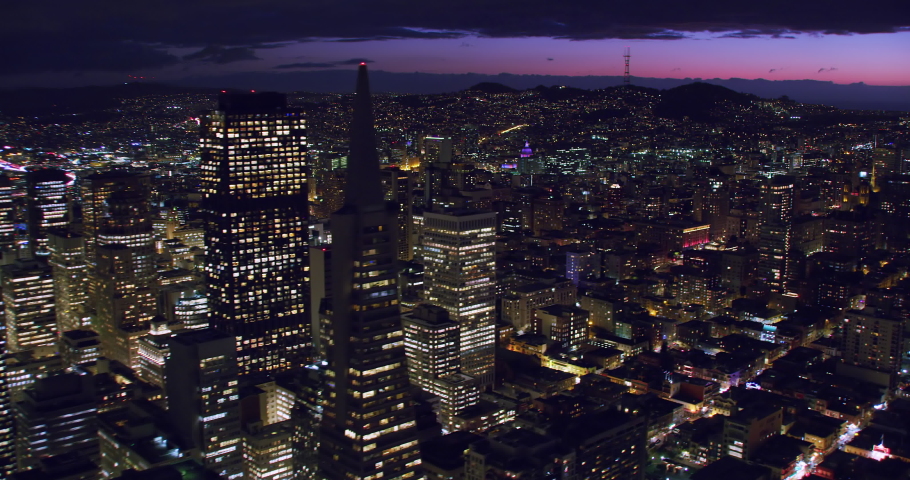 Aerial view of the San Francisco Financial District at night. Famous skyscrapers. Shot in 8K. California, United States.