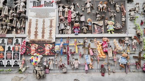Milan, Italy: 19 may 2021:The Wall of the Dolls (Il Muro delle Bambole). This poignant art installation by group of volunteer members raises awareness of violence against women