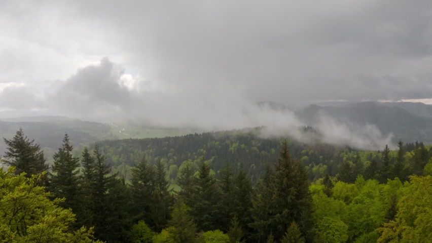 Clouds pass over a mountain in the northern black forest after a rain shower.