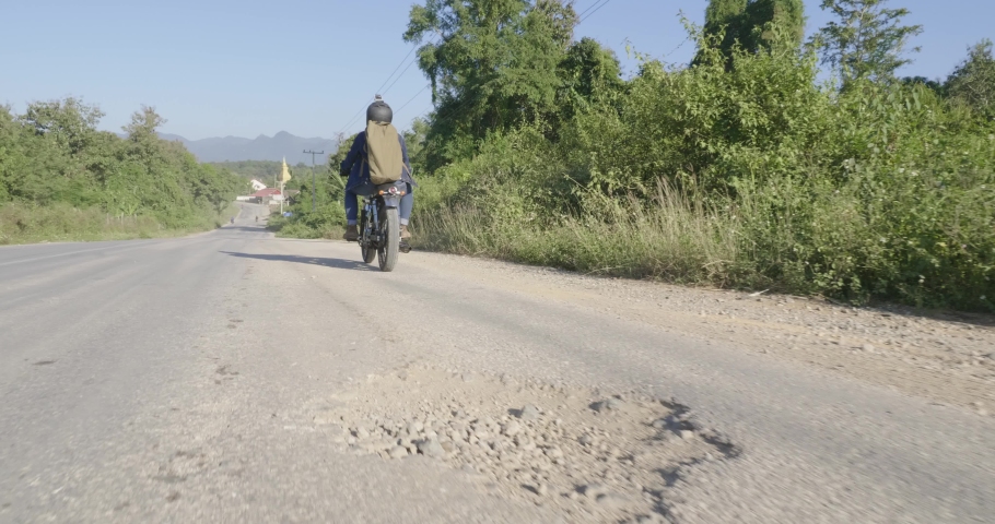 Driver Riding Motorcycle On The Country Road