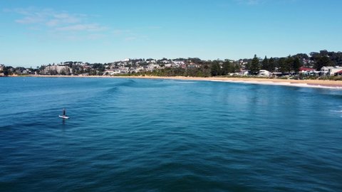 Drone aerial landscape scenic shot of stand up paddle-board and view of Terrigal Beach Pacific Ocean Central Coast NSW Australia 3840x2160 4K