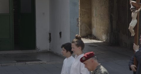 KNIN, CROATIA - June 13, 2014: People walking in a religious procession to celebrate the day of St. Anthony patron of their city.