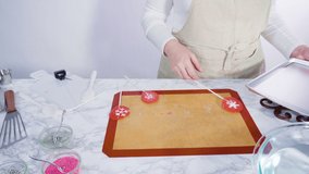 Time lapse. Step by step. Peeling cooled homemade lollipops from silicone baking mats.