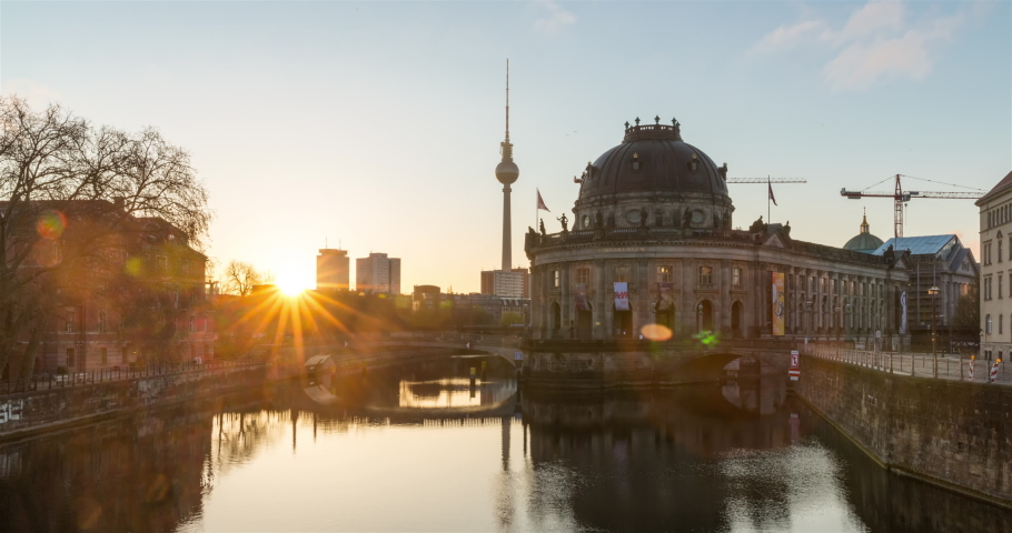 Sunrise hyperlapse of Berlin city skyline with TV Tower, spree river and muesum, no people in 4k in Berlin, Germany