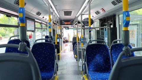 Tel Aviv, Israel - May 21, 2021: Bus riding. View from the back seat on the empty bus. Bus going straight ahead. 