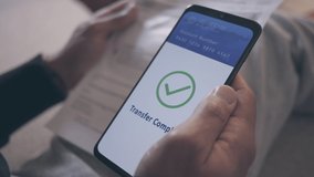 Close up of a male hand holding smartphone, making bill payment transaction via QR code reader and mobile paying app - Powered by Shutterstock - Get 15% off with code: PIKWIZARD15