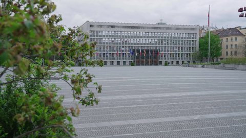 LJUBLJANA, SLOVENIA - 2021: Slovenian Parliament building with European flags reveal shot 4K
