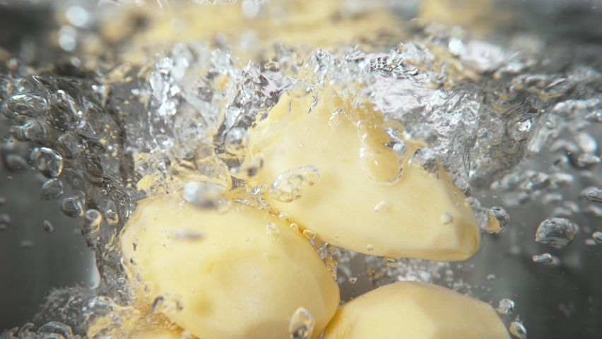 Peeled Potatoes Falling into Pot with Boiling Water in Macro 1000fps (Phantom Flex)