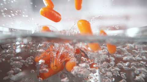 Frozen Baby Carrots Falling into Pot with Boiling Water in Macro 1000fps (Phantom Flex)