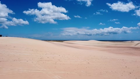 Great Sand Dunes of Jericoacoara Beach, Ceara, Brazil. Summer travel destination. Beauty in nature landscape. Jericoacoara, Ceara, Brazil. Outdoor beach scenery. Desert dunes tropical climate.