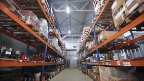 Warehouse with racks and shelves, filled with wooden boxes on pallets. Distribution products. Logistics Business. interior large warehouse with freight stacked high. Dolly shot - Powered by Shutterstock - Get 15% off with code: PIKWIZARD15