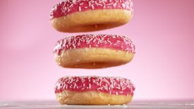 Delicious donuts falls on pastel background. Super Slow motion - Powered by Shutterstock - Get 15% off with code: PIKWIZARD15