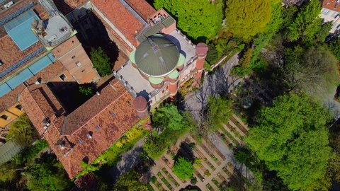 Aerial view of the Brera Botanical Garden and the domes of the Brera Astronomical Observatory. University and Pinacoteca. Roofs of buildings. Tourist place. Green. Milan Italy May 2021 