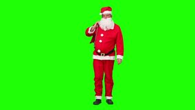 Chromakey footage of a Santa Claus holding a bag of gift and dancing
